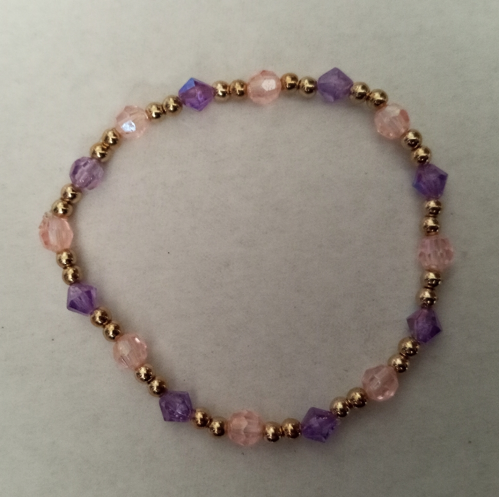 Hand Crafted Gold plated and pastel pink and lilac crystal beaded bracelet